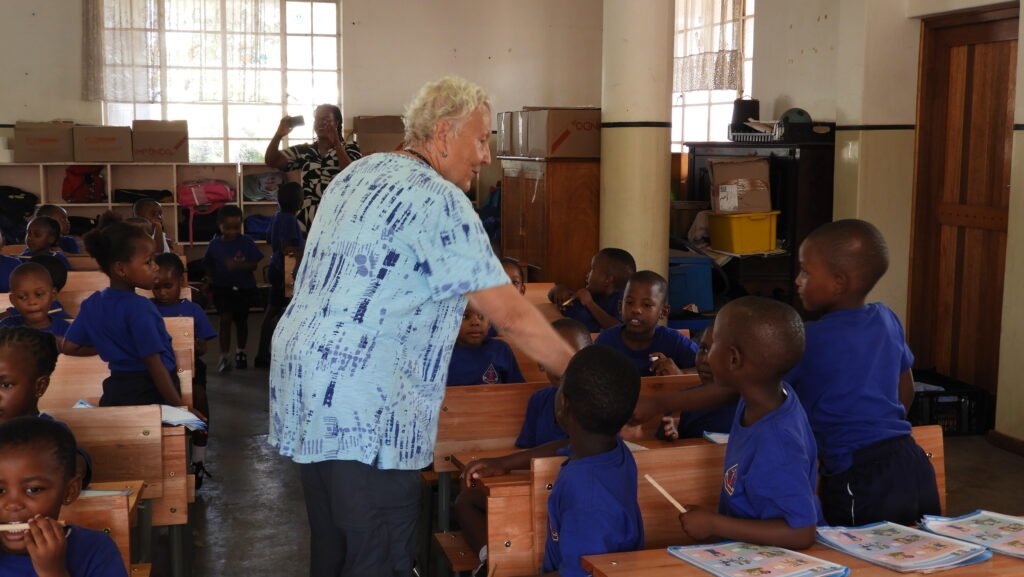 Grade R learners at Little flower being greeted by Michelle